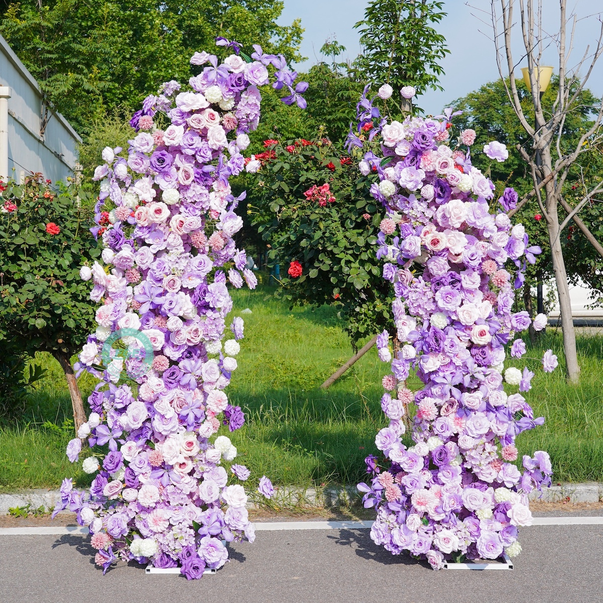 White horn wedding arch with purple flowers