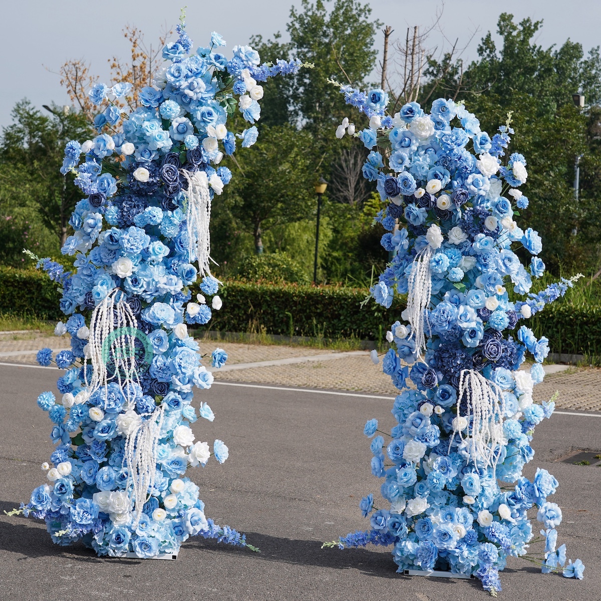 White horn wedding arch with blue flowers